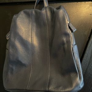 Navy blue soft leather backpack.